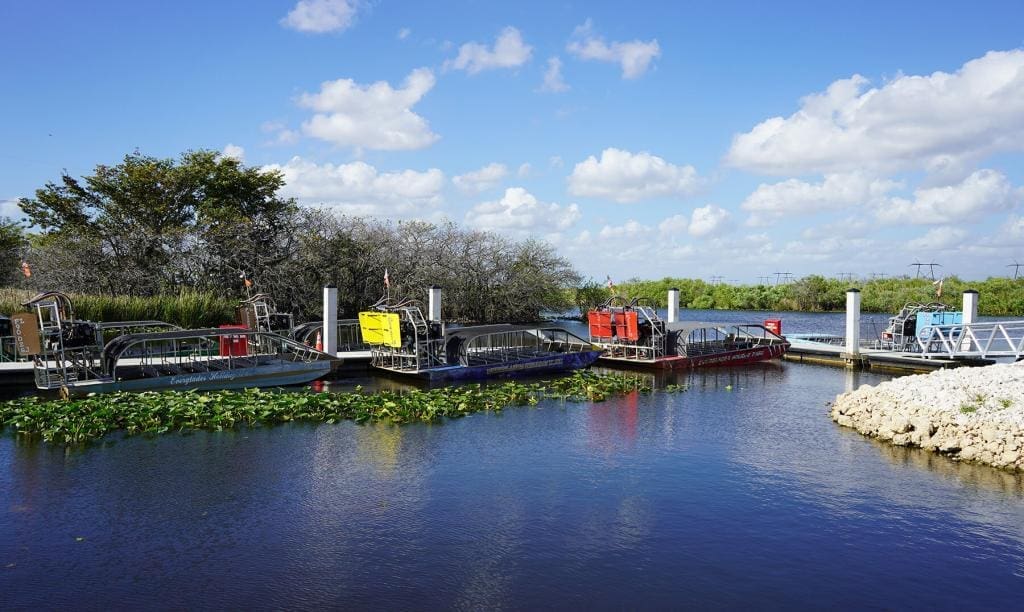 Docked air boats ready for an Everglades tours at a Florida gator park marina